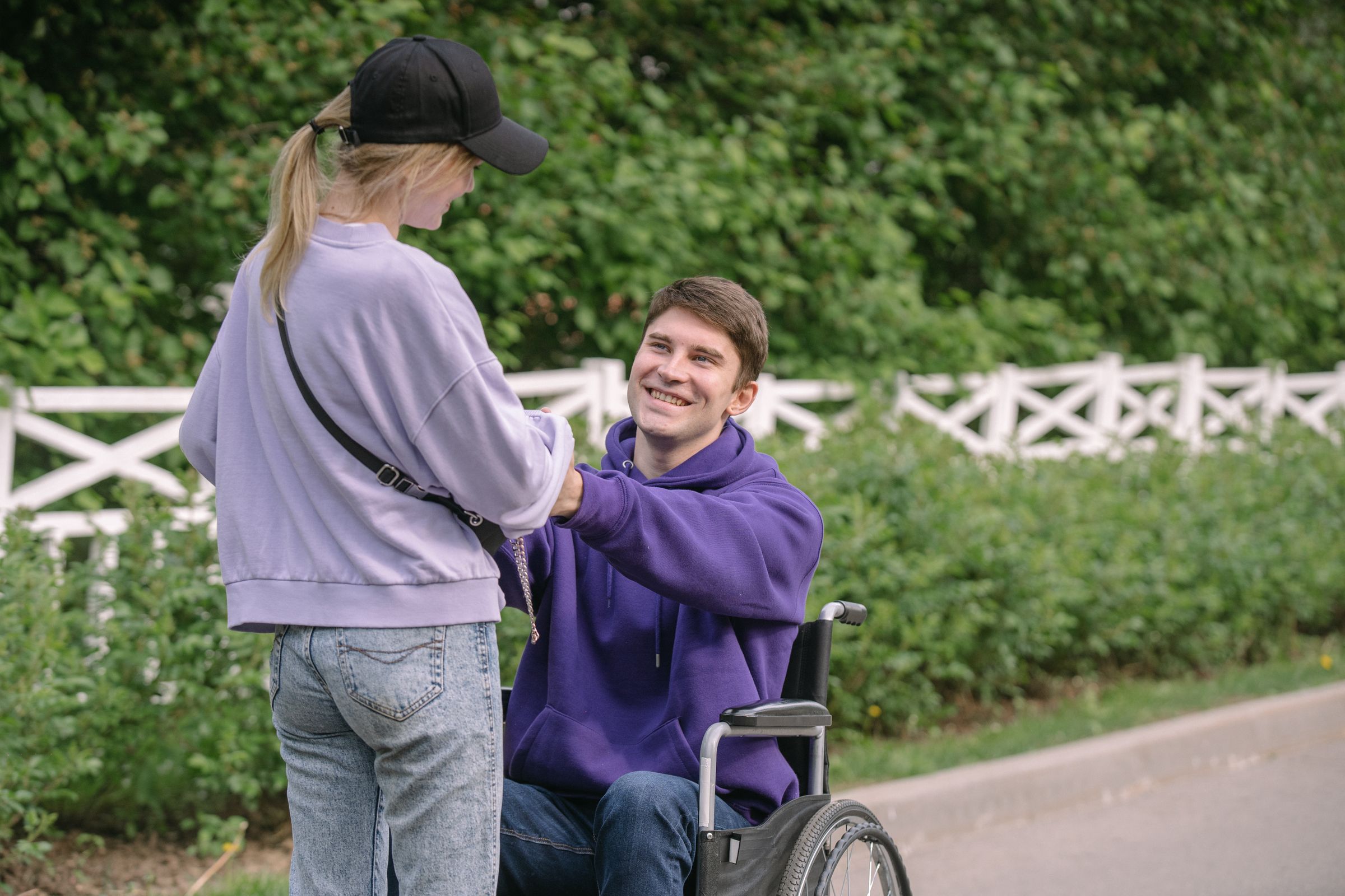 A support worker and participant enjoying a relaxed conversation outdoors